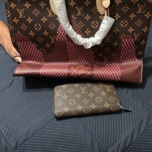 A Louis Vuitton handbag with wallet
